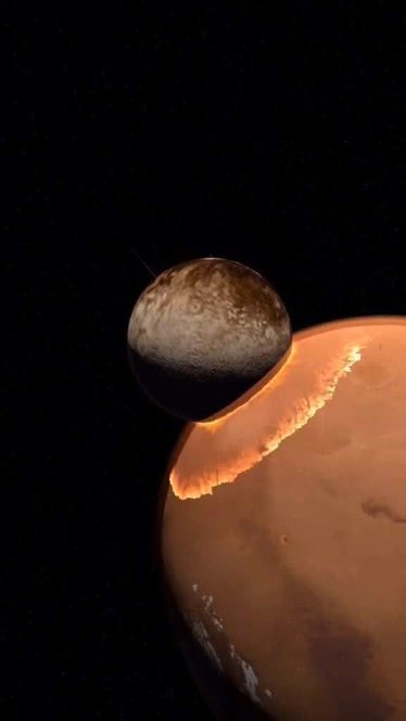 冥王星拱火星图片